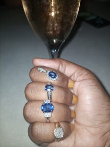 tanzanite jewellery near champagne glass