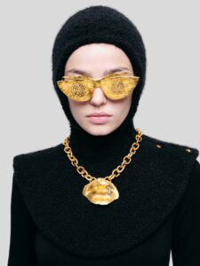 Schiaparelli Gold sunglasses worn by model